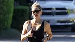 Kate Hudson Shows off Her Sculpted Physique in Plunging Black Top and Leggings as She Walks Barefoot